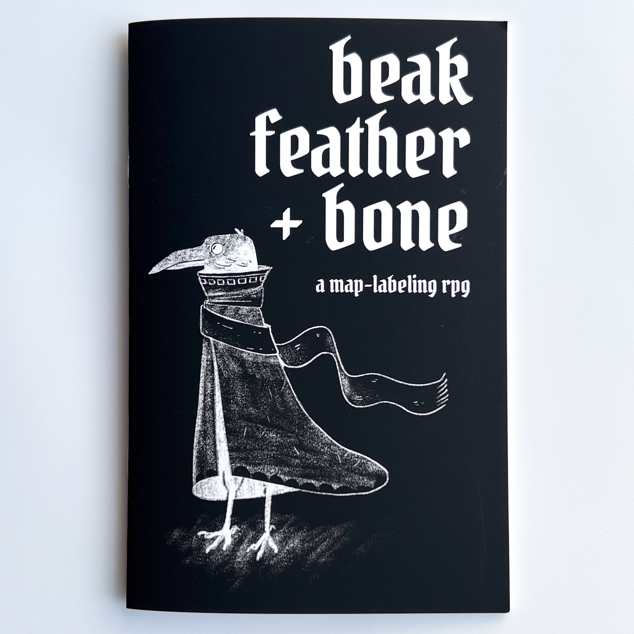 beak feather + bone | Grognard Games